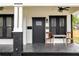 Inviting front porch with a cozy seating area, stylish design elements, and a welcoming entrance at 911 S Missouri Ave, Lakeland, FL 33803