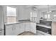 Kitchen featuring new stainless-steel appliances, cabinetry and countertops at 911 S Missouri Ave, Lakeland, FL 33803