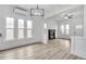 Open living room with fireplace and many windows at 911 S Missouri Ave, Lakeland, FL 33803