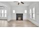 Bright living room with black painted brick fireplace and many windows at 911 S Missouri Ave, Lakeland, FL 33803