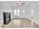 Open living room showcasing the front door and a black painted fireplace at 911 S Missouri Ave, Lakeland, FL 33803