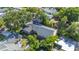 Aerial shot of home, highlighting the well-maintained roof and lush greenery with mature trees at 916 Woodward St, Lakeland, FL 33803