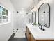 Beautiful bathroom features dual sinks, modern fixtures, and a tiled shower at 916 Woodward St, Lakeland, FL 33803