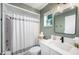 Updated bathroom features a shower with tub and modern vanity at 916 Woodward St, Lakeland, FL 33803