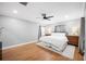 Neutral primary bedroom with hardwood floors, ceiling fan, and lots of light at 916 Woodward St, Lakeland, FL 33803