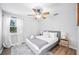 Comfortable bedroom with a ceiling fan, soft decor and lots of natural light at 916 Woodward St, Lakeland, FL 33803