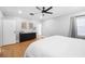 Bedroom showcasing wood floors, neutral walls, black dresser and white linens at 916 Woodward St, Lakeland, FL 33803