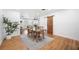 Dining area with wooden table and chairs, leading into a spacious living room at 916 Woodward St, Lakeland, FL 33803