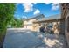 View of a three-car garage and driveway provide ample parking in a well-maintained and private exterior at 916 Woodward St, Lakeland, FL 33803