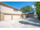 Spacious three-car garage and extended driveway offers ample parking and storage in a well-maintained exterior at 916 Woodward St, Lakeland, FL 33803