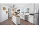 Updated kitchen features stainless steel appliances, white cabinets, and lots of natural light at 916 Woodward St, Lakeland, FL 33803