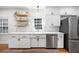 Bright kitchen features white cabinets, stainless appliances, and a modern design at 916 Woodward St, Lakeland, FL 33803