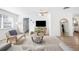 Sun-filled living area featuring a cozy couch, modern decor, and stylish furnishings for a relaxed atmosphere at 916 Woodward St, Lakeland, FL 33803