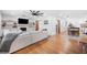 Open living room with hardwood floors, fireplace, and barn doors to adjacent rooms at 916 Woodward St, Lakeland, FL 33803