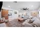 Open-concept living room features wood floors, a decorative rug, and lots of light at 916 Woodward St, Lakeland, FL 33803