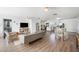 Bright open concept living room featuring wood floors, modern furnishings and lots of natural light at 916 Woodward St, Lakeland, FL 33803