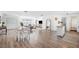 Open floor plan with dining and living area, seamlessly blends style and functionality, ideal for modern living at 916 Woodward St, Lakeland, FL 33803