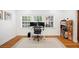 Bright office space with dual monitors, hardwood floors, and natural light at 916 Woodward St, Lakeland, FL 33803