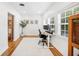 Bright home office with wood floors, lots of windows, and modern fixtures at 916 Woodward St, Lakeland, FL 33803