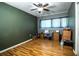 Spacious bedroom with wood-look flooring, ceiling fan, and ample natural light, ready for personalization at 960 Lila St, Bartow, FL 33830