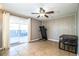 Versatile bonus room with sliding glass doors, tile flooring, and a ceiling fan, perfect for recreation or relaxation at 960 Lila St, Bartow, FL 33830
