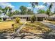 Quaint one-story home with covered parking and mature landscaping in a quiet neighborhood at 960 Lila St, Bartow, FL 33830