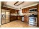 Modern kitchen featuring stainless steel appliances, ample cabinetry, and durable tile flooring, perfect for culinary enthusiasts at 960 Lila St, Bartow, FL 33830