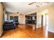 Spacious living room with hardwood floors leading to the updated kitchen and dining area at 960 Lila St, Bartow, FL 33830