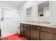Bathroom features a walk-in shower, granite countertop, dual sinks, and mirrors at 120 Grove Branch Rd, Winter Haven, FL 33880