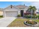 Lovely single-story home with a well-maintained lawn and inviting front garden at 120 Grove Branch Rd, Winter Haven, FL 33880