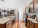 Contemporary kitchen featuring stainless steel appliances, granite countertops, and a breakfast bar at 120 Grove Branch Rd, Winter Haven, FL 33880
