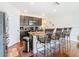 Modern kitchen with dark cabinetry, granite countertops, and stainless steel appliances at 120 Grove Branch Rd, Winter Haven, FL 33880