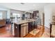 Spacious kitchen with a large island, stainless steel appliances, and dark wood cabinets at 120 Grove Branch Rd, Winter Haven, FL 33880
