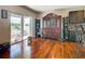Living room with hardwood floors, sliding glass doors, and large wooden furniture at 120 Grove Branch Rd, Winter Haven, FL 33880