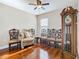 Sitting room features hardwood floors, ceiling fan, and decorative seating at 120 Grove Branch Rd, Winter Haven, FL 33880