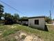 View of the backyard with a storage unit and partial fence line at 1208 Lowry Ave, Haines City, FL 33844
