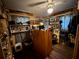 Cluttered bedroom with an ceiling fan, desk, and various items on shelves and around the room at 1208 Lowry Ave, Haines City, FL 33844