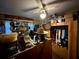 Cluttered bedroom with an ceiling fan, desk, and various items on shelves and around the room at 1208 Lowry Ave, Haines City, FL 33844