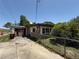 View of home featuring stone accents, and private yard with mature foliage at 1208 Lowry Ave, Haines City, FL 33844