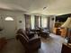 Inviting living room with tile floors, comfortable seating, and lots of natural light at 1208 Lowry Ave, Haines City, FL 33844