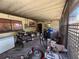 Overgrown, cluttered screened-in porch with tools and other items scattered throughout at 1208 Lowry Ave, Haines City, FL 33844