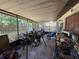 Enclosed porch featuring lattice and access to the backyard at 1208 Lowry Ave, Haines City, FL 33844