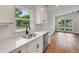 Bright kitchen with granite countertops and stainless steel sink overlooking the yard at 1242 Dorothy St, Lakeland, FL 33815