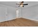 Spacious bedroom with wood-look flooring and a white door at 1246 Dorothy St, Lakeland, FL 33815