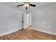 Bedroom with hardwood floors, ceiling fan, closet and view to another room at 1246 Dorothy St, Lakeland, FL 33815