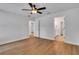 Bedroom with access to a bathroom with a vanity and tiled floor at 1246 Dorothy St, Lakeland, FL 33815