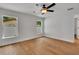 Bright bedroom featuring wood-look flooring and dual windows at 1246 Dorothy St, Lakeland, FL 33815