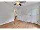 Bedroom with hardwood floors, ceiling fan, closet and view to another room at 1246 Dorothy St, Lakeland, FL 33815