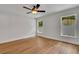 Bright bedroom with wood-look flooring, a ceiling fan, and lots of natural light at 1246 Dorothy St, Lakeland, FL 33815