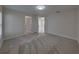Bright bedroom offers neutral walls and plush carpeting for comfort at 1415 Southern Ave, Lakeland, FL 33803
